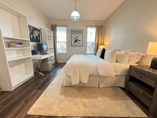 bedroom with dark wood-type flooring