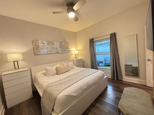 bedroom with dark wood-type flooring and ceiling fan