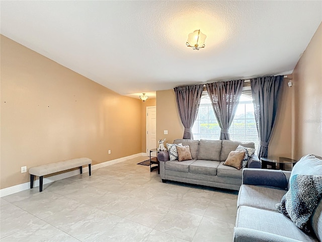 living room featuring a textured ceiling