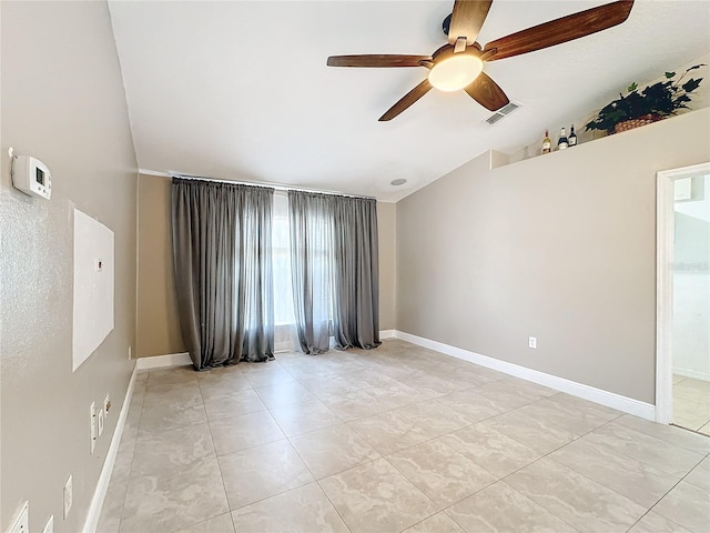 unfurnished room with ceiling fan, light tile patterned flooring, and vaulted ceiling