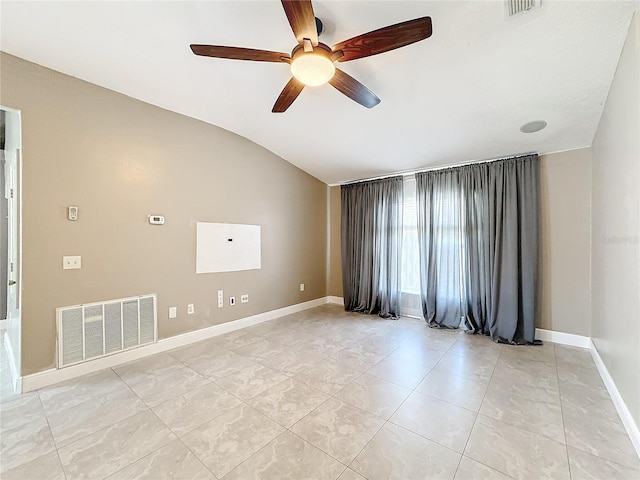 empty room featuring ceiling fan and vaulted ceiling