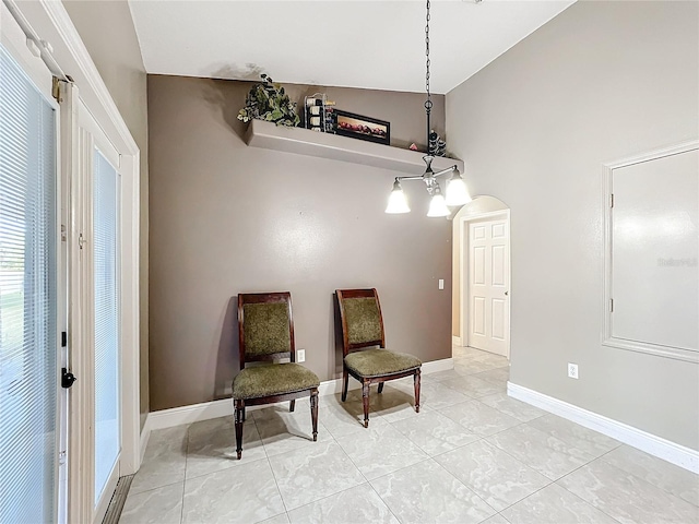 sitting room featuring vaulted ceiling