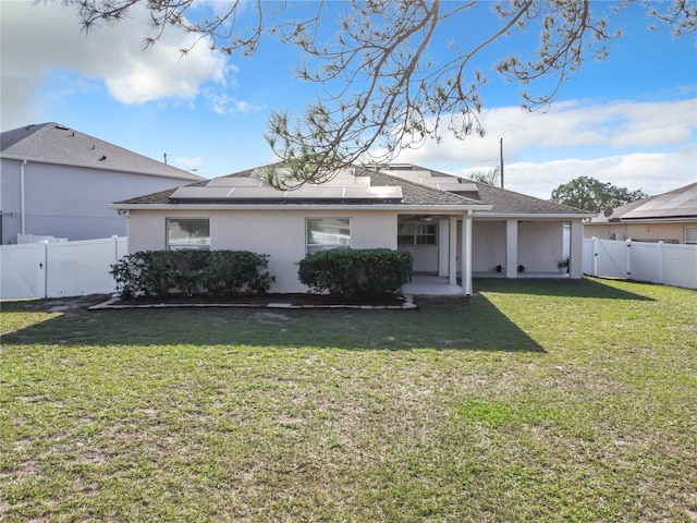 view of front of house with a front lawn and a patio area