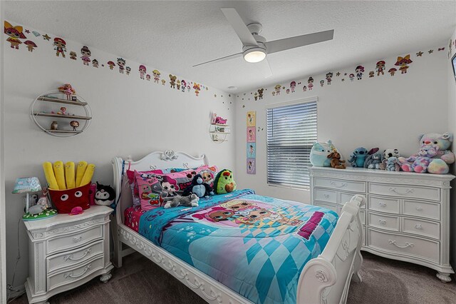 carpeted bedroom featuring ceiling fan and a textured ceiling