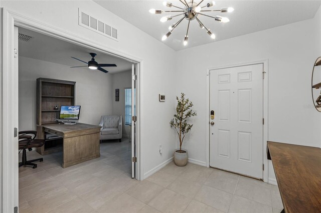 tiled entrance foyer with ceiling fan with notable chandelier