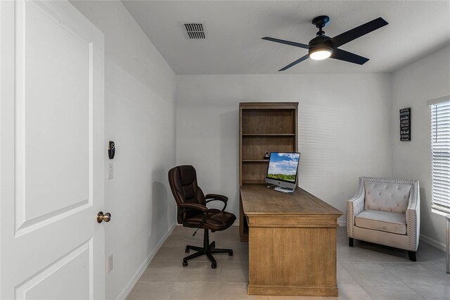 home office with light tile patterned flooring and ceiling fan