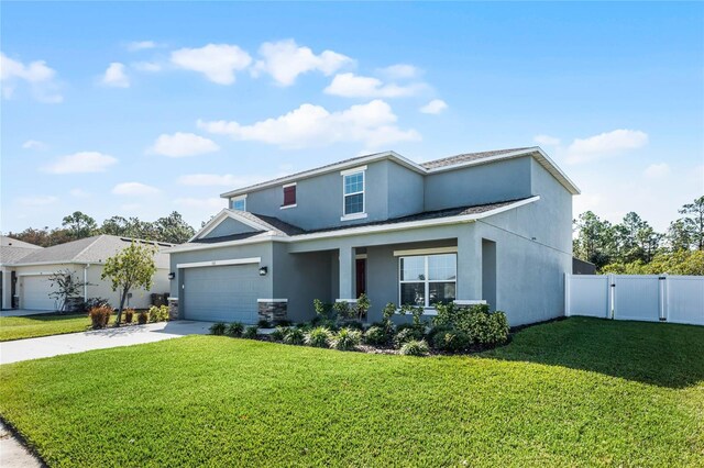 view of front of property featuring a front lawn and a garage