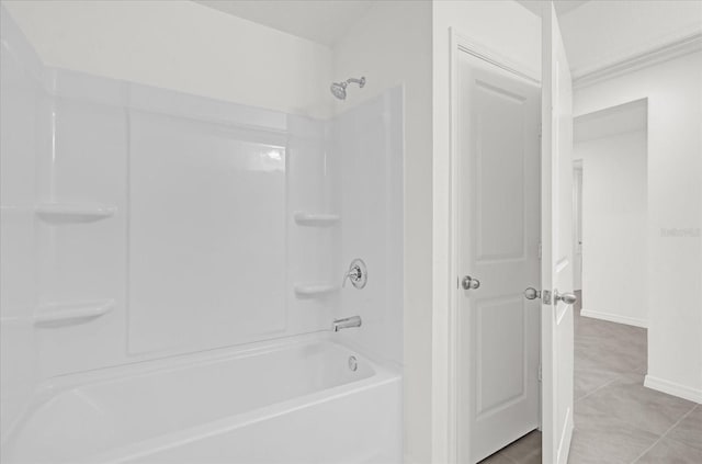 full bath featuring  shower combination and baseboards