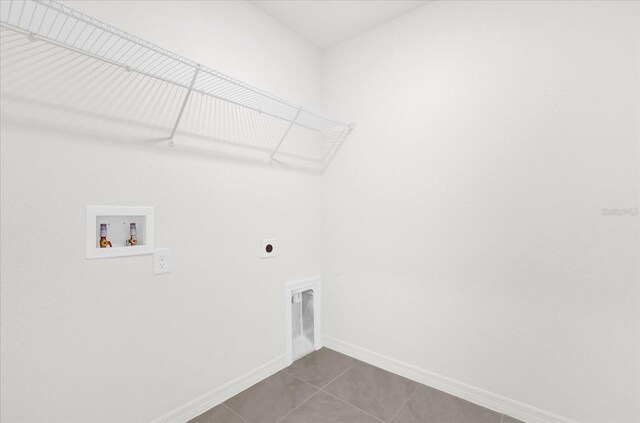 washroom featuring tile patterned flooring, hookup for a washing machine, hookup for an electric dryer, laundry area, and baseboards