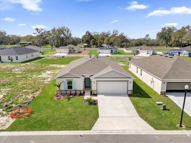 ranch-style house with a garage, driveway, roof with shingles, a residential view, and a front yard