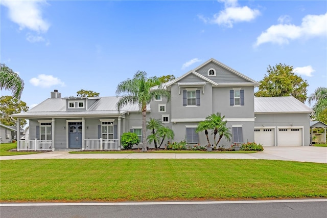 view of front facade with a porch, a front yard, and a garage