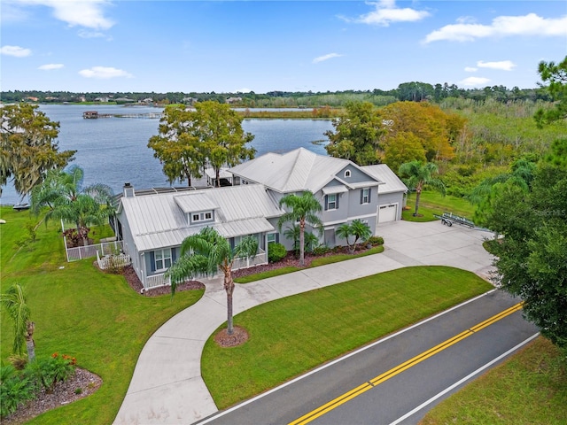 birds eye view of property with a water view