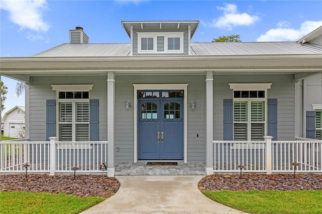 entrance to property featuring covered porch