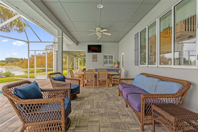 sunroom / solarium with ceiling fan