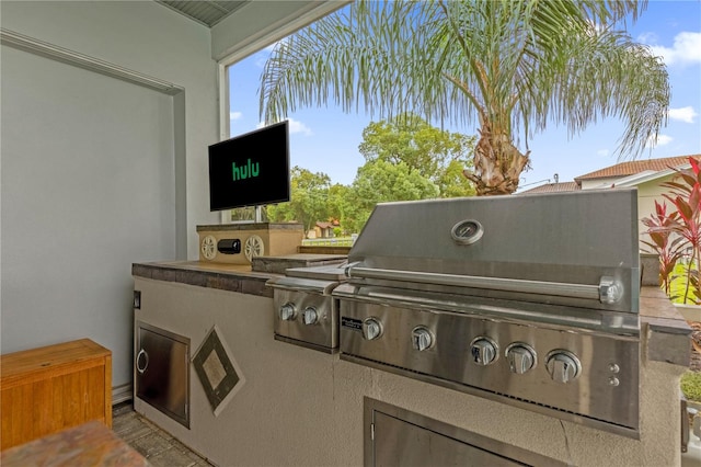 view of patio / terrace featuring exterior kitchen