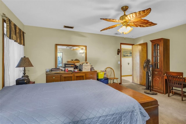 bedroom featuring light carpet, multiple windows, and ceiling fan