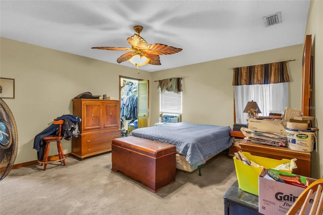 bedroom featuring light colored carpet and ceiling fan