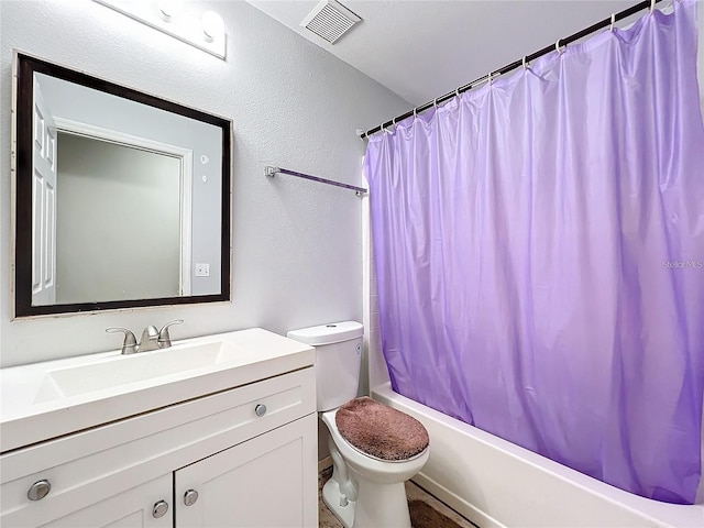 full bathroom with vanity, toilet, and shower / tub combo with curtain