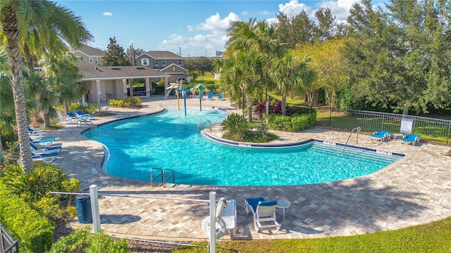 view of swimming pool with a patio