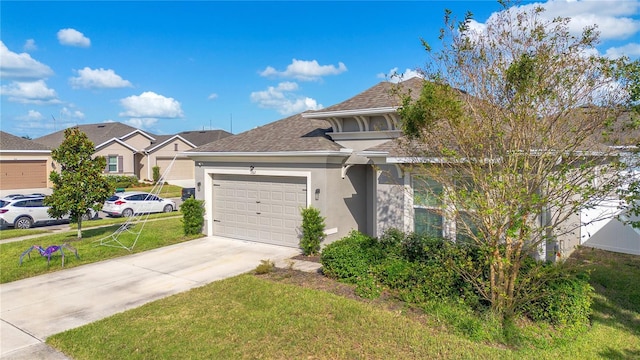 view of front of property featuring a front lawn and a garage