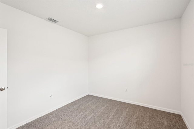 unfurnished room with carpet floors