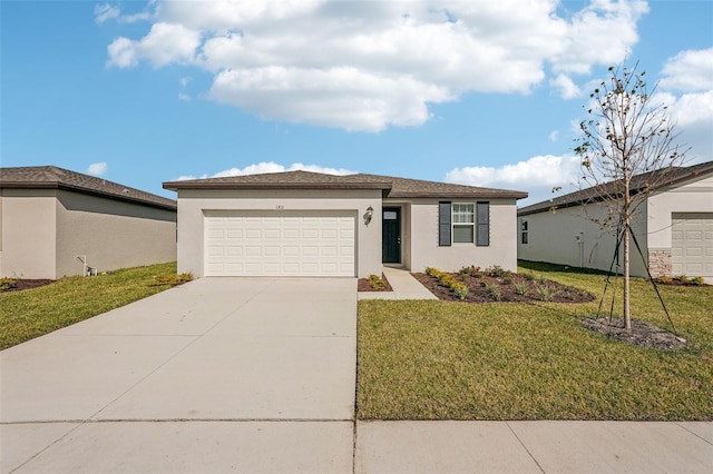 single story home featuring a front yard and a garage