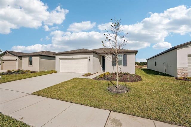 view of front facade with a garage and a front lawn