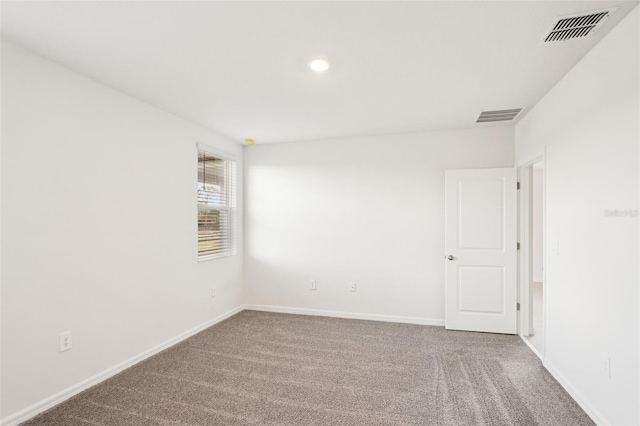 view of carpeted spare room