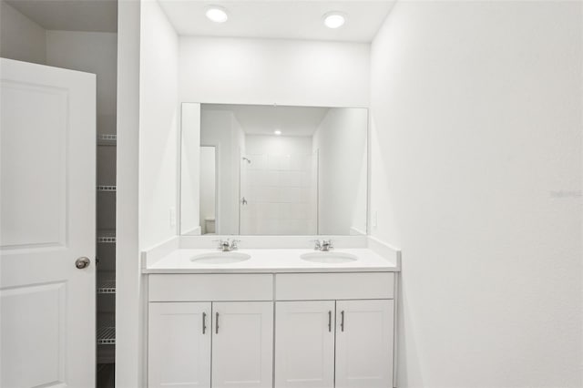 bathroom with a shower and vanity