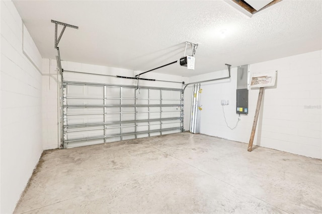 garage featuring electric panel and a garage door opener