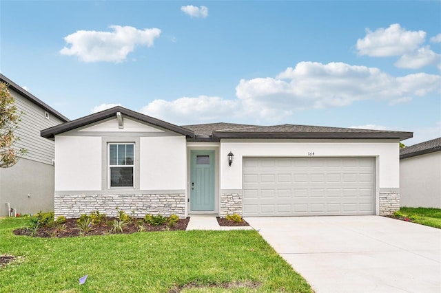 view of front of home featuring a garage and a front yard