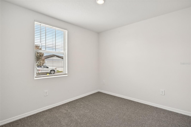 empty room featuring carpet flooring