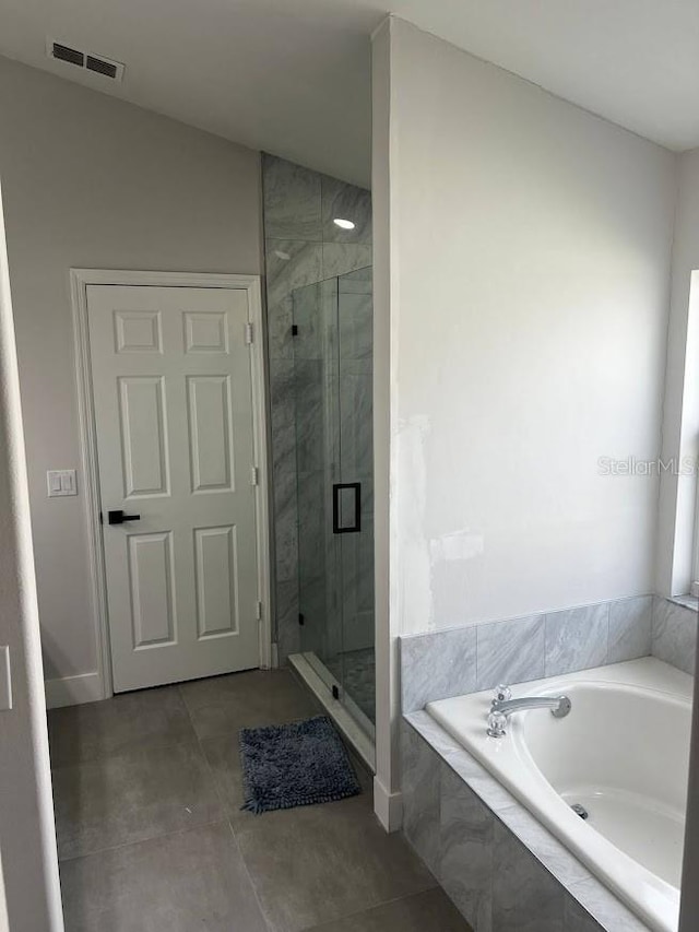 bathroom with shower with separate bathtub