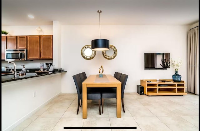 dining area with light tile patterned flooring