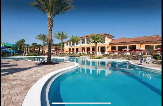 view of swimming pool with a patio area