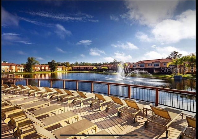 wooden deck featuring a water view