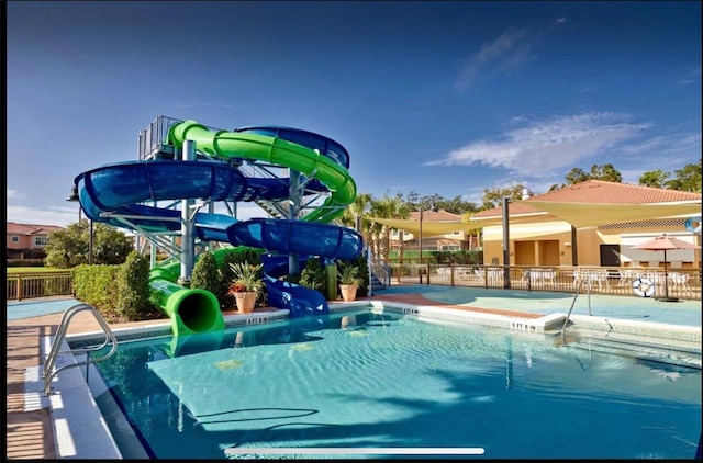 view of pool featuring a water slide