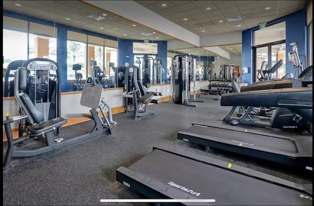 exercise room featuring a drop ceiling