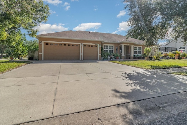 view of front of home with a front lawn and a garage