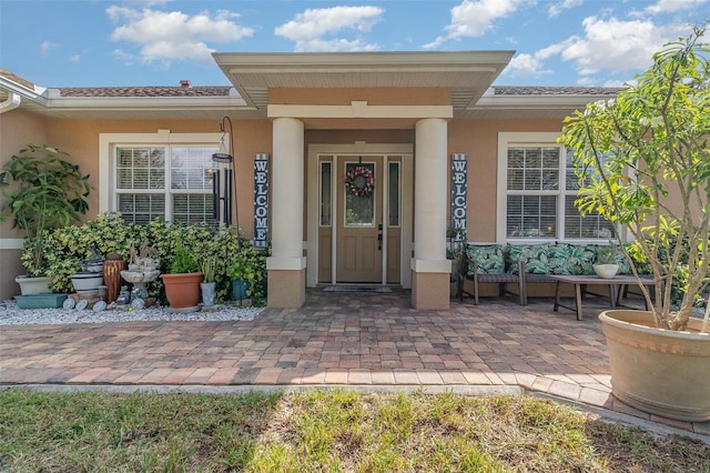 doorway to property with covered porch