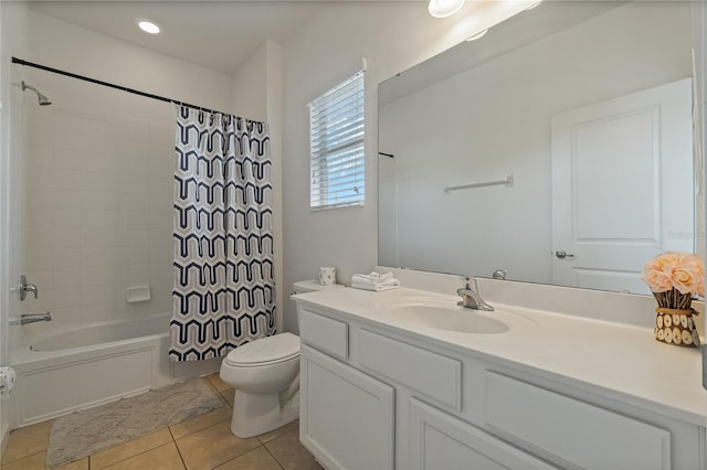 full bathroom with vanity, shower / bath combo with shower curtain, toilet, and tile patterned flooring