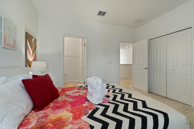 carpeted bedroom with a closet