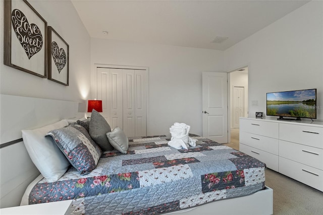 carpeted bedroom with a closet