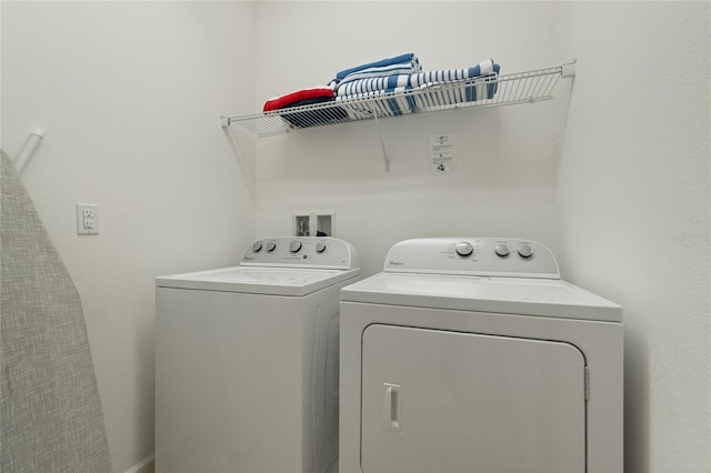 laundry room with washer and clothes dryer