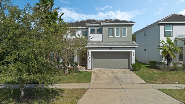 view of front facade featuring a front yard and a garage