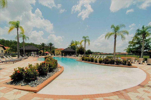 view of swimming pool featuring a patio and a gazebo