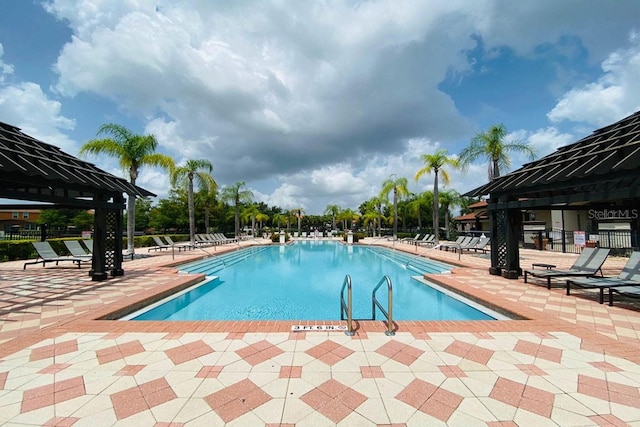 view of pool with a gazebo and a patio area