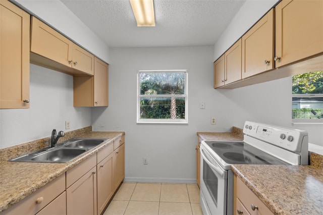 kitchen featuring a textured ceiling, white electric range, light brown cabinetry, light tile patterned flooring, and sink