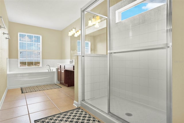 bathroom with vanity, tile patterned floors, and separate shower and tub