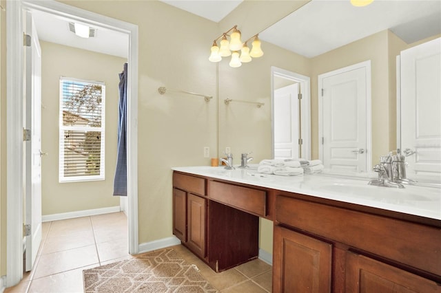 bathroom with vanity and tile patterned floors